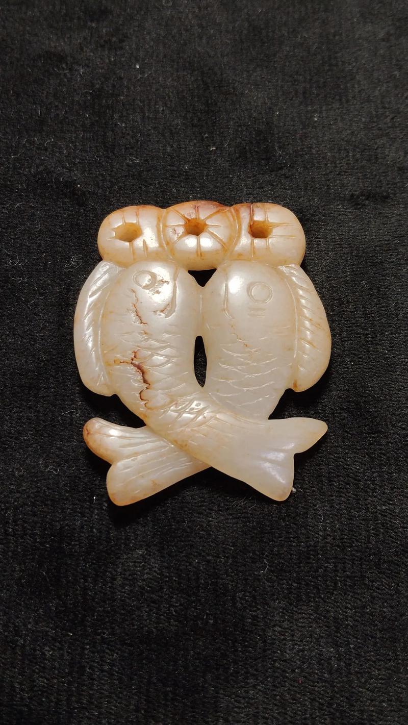 双鱼玉佩事件疯了，双鱼玉佩事件详细过程？  第2张